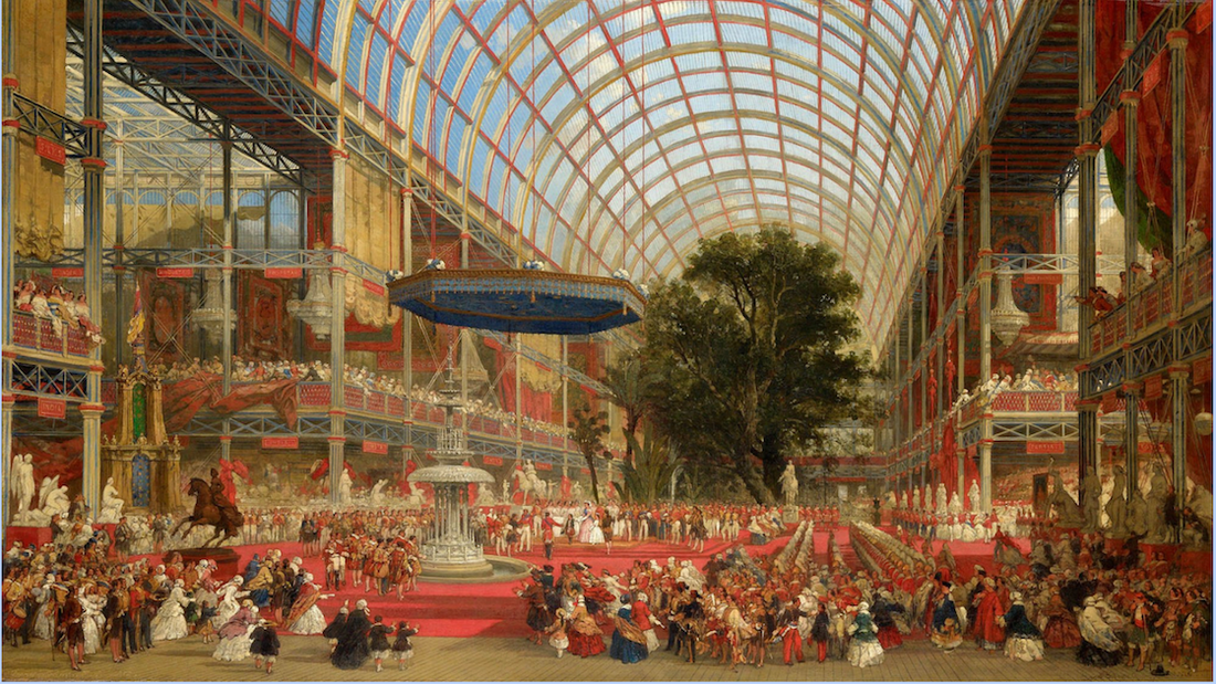 Image of a large hall with people and red coloured drapery.