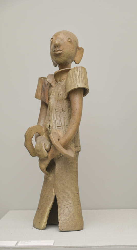 Figure with folded hand